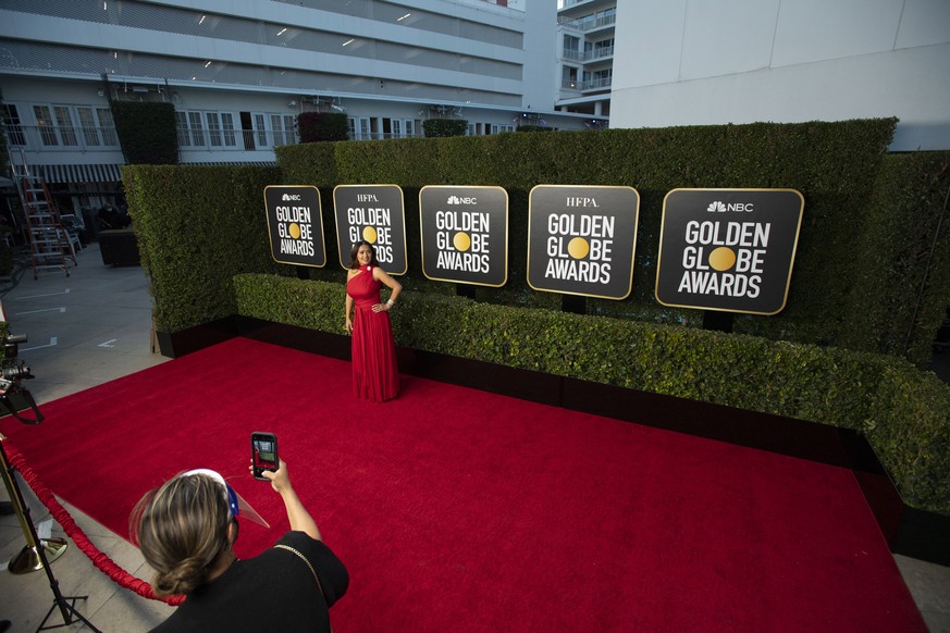 epa09043909 Handout image released by the Hollywood Foreign Press Association showing Salma Hayek arriving for the 78th annual Golden Globe Awards ceremony at the Beverly Hilton Hotel, in Beverly Hill ...