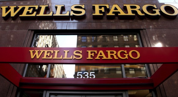 FILE - In this May 6, 2012, file photo, a Wells Fargo sign is displayed at a branch in New York. In the results of an investigation released Monday, April 10, 2017, Wells Fargo&#039;s board of directo ...