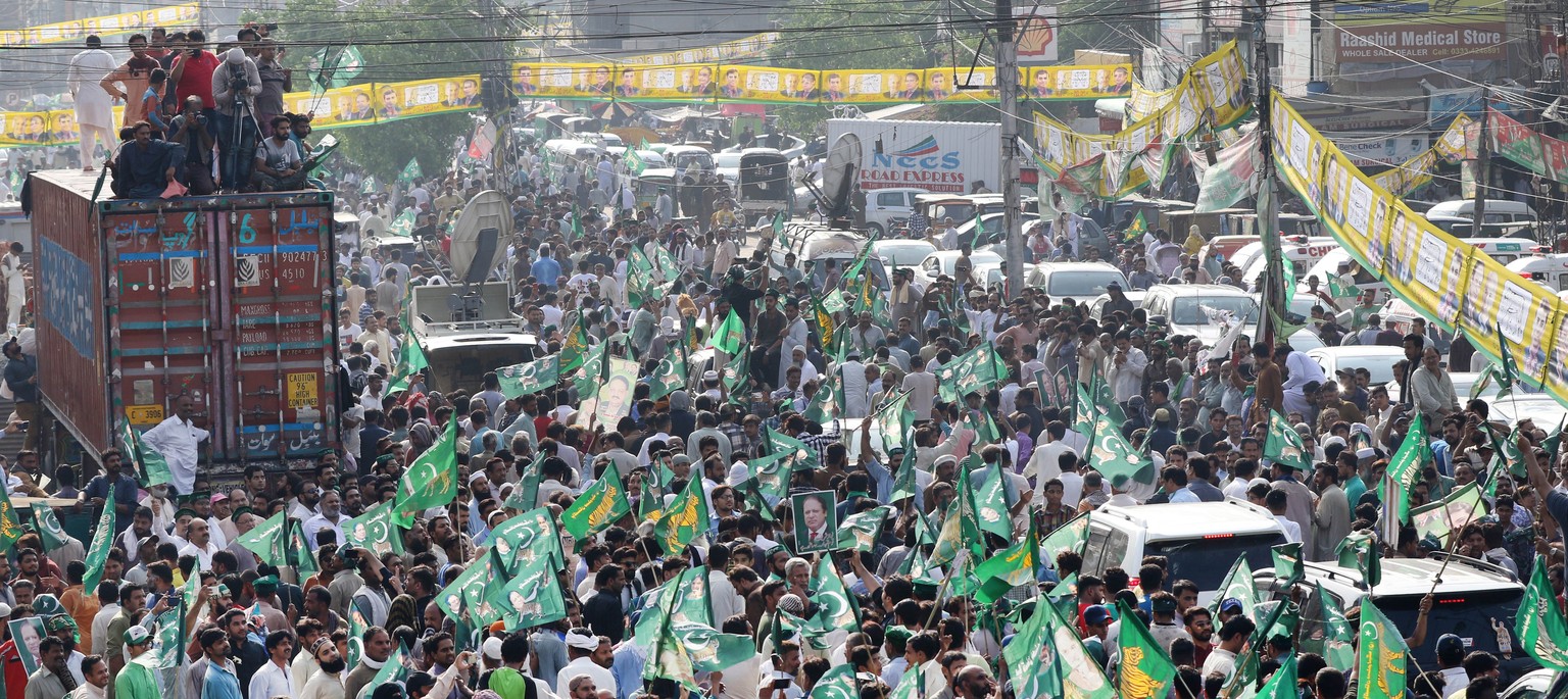 epa06886125 Supporters of former Prime Minister Nawaz Sharif, rally as Sharif is expected to return to the country, in Lahore, Pakistan, 13 July 2018. Pakistani authorities deployed some 10,000 police ...