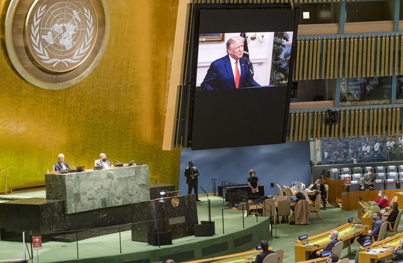 In this photo provided by the United Nations, U.S. President Donald Trump, is on video screens as his pre-recorded message is played during the 75th session of the United Nations General Assembly, Tue ...