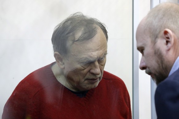 epa07988343 Oleg Sokolov (L) listens to his lawyer before the trial in the courtroom in St. Petersburg, Russia, 11 November 2019. Oleg Sokolov, a Russian historian and teacher at St. Petersburg State  ...