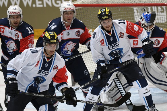 Zurich&#039;s Mattias Sjoegren, behind left, and Christian Marti, behind right, and Ingolstadt&#039;s Darryl Boyce, front left, and Danny Irmen, front right, during the Champions Hockey League Group D ...