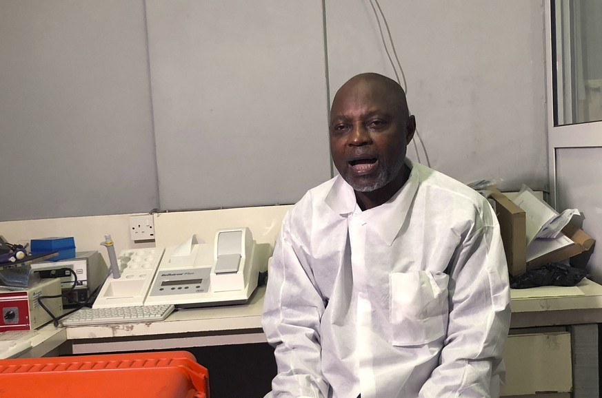 In this photo taken on Friday, Dec. 25, 2020, Virologist Sunday Omilabu speaks, during an interview with The Associated Press, in Lagos, Nigeria. A Nigerian scientist has spent the holiday season in h ...