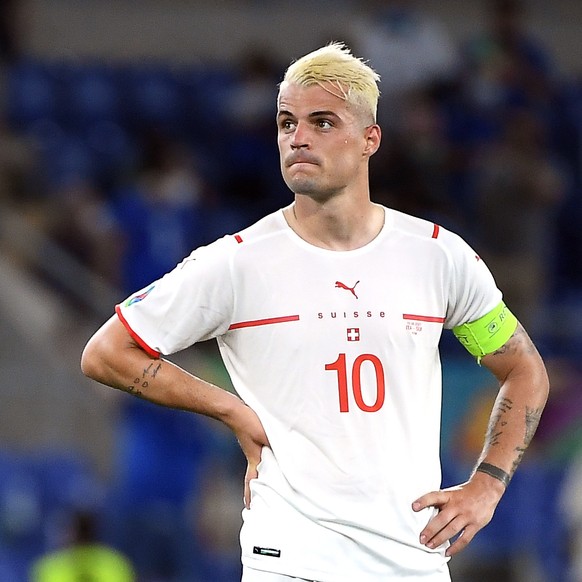 epa09278329 Granit Xhaka of Switzerland reacts after the UEFA EURO 2020 group A preliminary round soccer match between Italy and Switzerland in Rome, Italy, 16 June 2021. EPA/Ettore Ferrari / POOL (RE ...