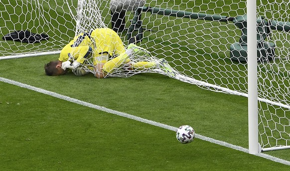 Scotland&#039;s goalkeeper David Marshall is caught in the goal&#039;s net after he failed to save a long distance shot by Czech Republic&#039;s Patrik Schick during the Euro 2020 soccer championship  ...