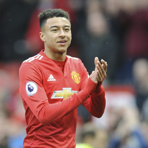 Manchester United&#039;s Jesse Lingard applauds the fans as he walks from the pitch after the end of the English Premier League soccer match between Manchester United and Liverpool at Old Trafford in  ...