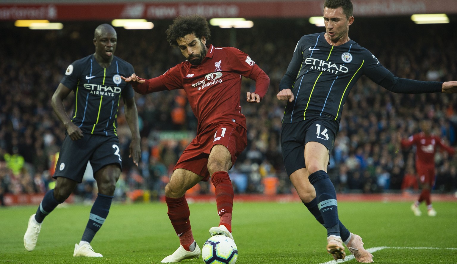epa07077278 Liverpool&#039;s Mohamed Salah (L) in action with Manchester City&#039;s Aymeric Laporte (R) during the English Premier League soccer match between Liverpool and Manchester City at Anfield ...