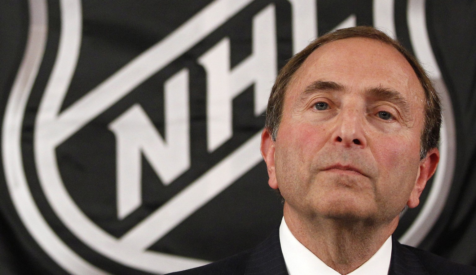 FILE - In this Sept. 13, 2012, file photo, NHL commissioner Gary Bettman listens as he meets with reporters after a meeting with team owners in New York. The National Hockey Leage Players&#039; Associ ...