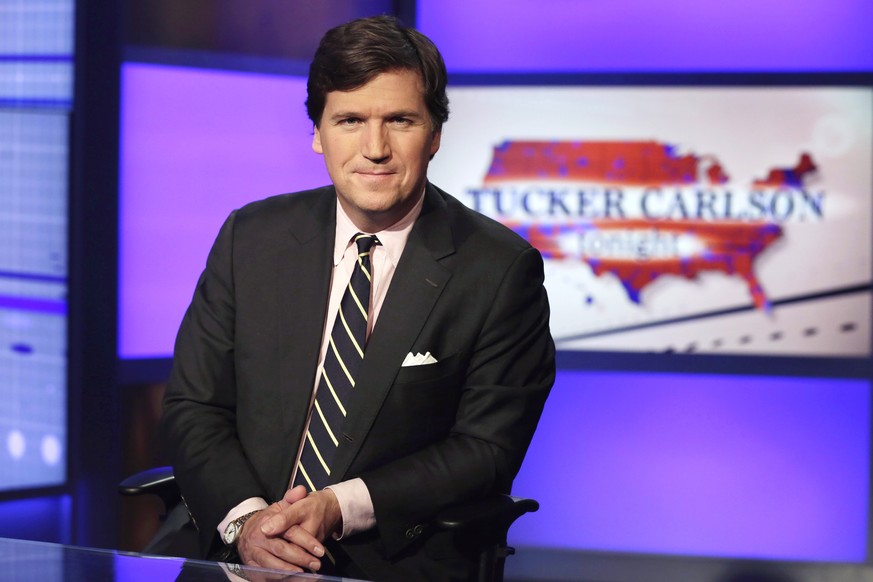 Tucker Carlson, host of &quot;Tucker Carlson Tonight,&quot; poses for photos in a Fox News Channel studio, in New York in this March 2, 2017, file photo. A Manhattan judge has tossed out a defamation  ...