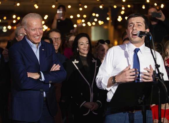 Former Democratic presidential primary candidate Pete Buttigieg endorses Joe Biden, during an event at the Chicken Scratch restaurant the night before Super Tuesday primary voting, on Monday night, Ma ...