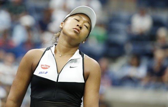 epa07813373 Naomi Osaka of Japan reacts as she plays Belinda Bencic of Switzerland during their match on the eighth day of the US Open Tennis Championships the USTA National Tennis Center in Flushing  ...