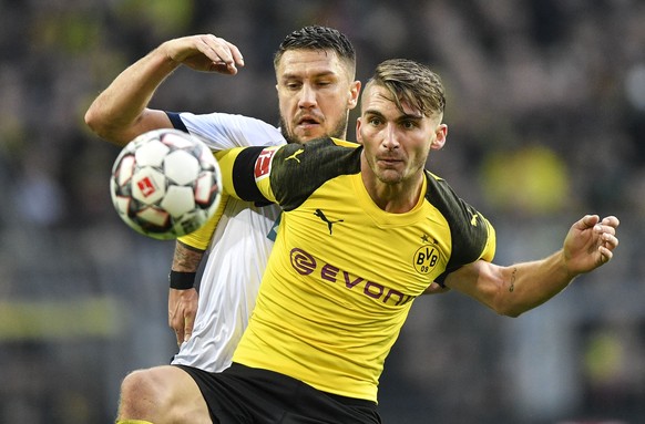 Dortmund&#039;s Maximilian Philipp, in front, and Hoffenheim&#039;s Ermin Bicakcic challenge for the ball during the German Bundesliga soccer match between Borussia Dortmund and TSG 1899 Hoffenheim in ...