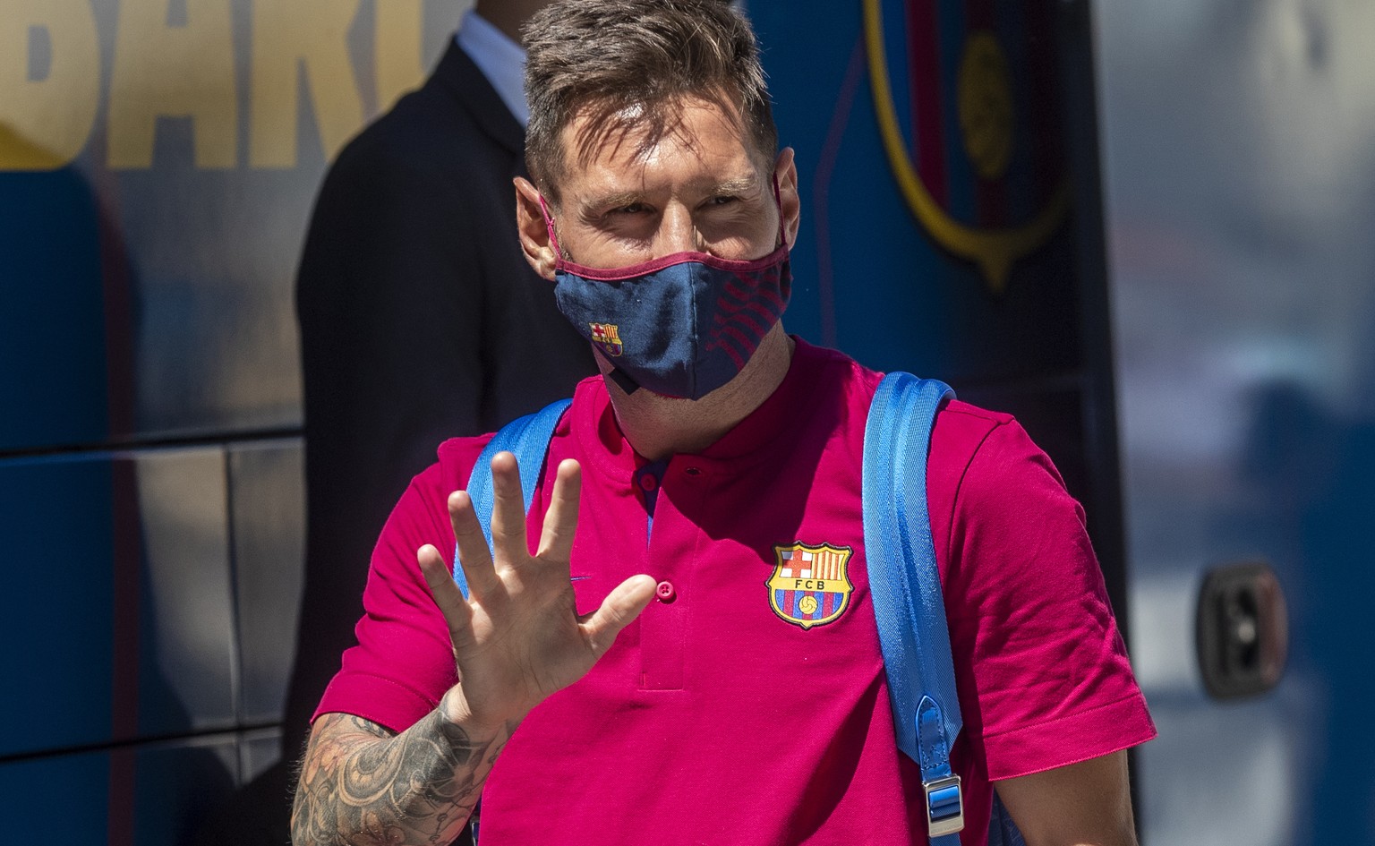 FILE - In this Aug. 13, 2020 file photo, Barcelona&#039;s Lionel Messi waves as he arrives at the team hotel in Lisbon, Portugal. Lionel Messi has told Barcelona he wants to leave the club after nearl ...