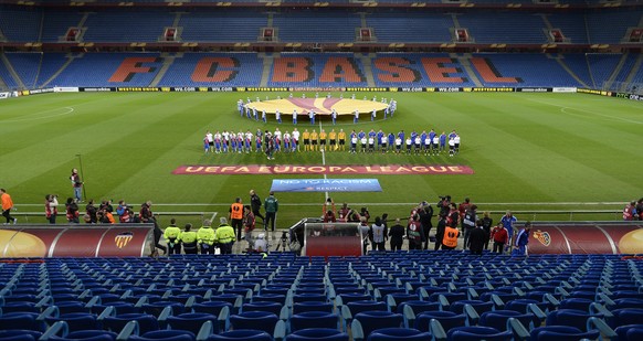 The teams in the empty stadium prior to the UEFA Europa League quarter final first leg soccer match between Switzerland&#039;s FC Basel 1893 and Spain&#039;s Valencia CF behind closed doors at the St. ...