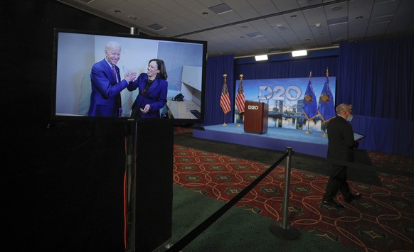 epa08611843 Democratic US presidential candidate and former Vice President Joe Biden and his vice presidential running mate Senator Kamala Harris appear on a video feed at the start of the second day  ...