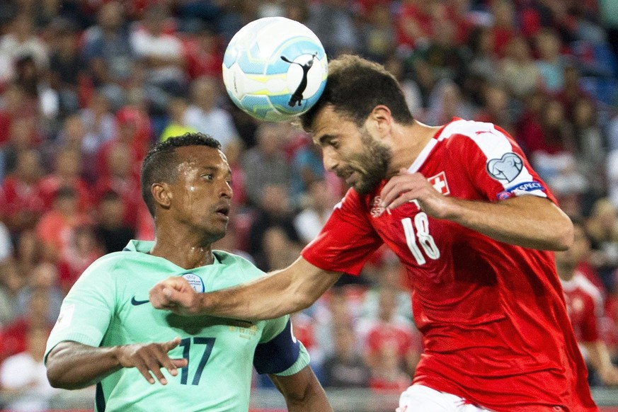 epa05527597 Portugal&#039;s Nani (L) in action against Swiss midfielder Admir Mehmedi (R) during the FIFA World Cup 2018 group B qualifying soccer match between Switzerland and Portugal at the St. Jak ...