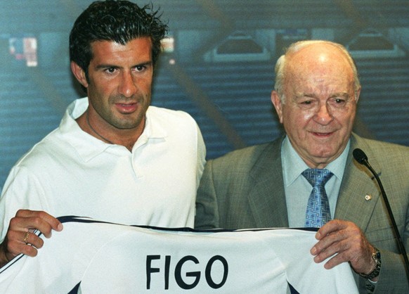 FILE - In this Monday, July 24, 2000 file photo, Portuguese soccer player Luis Figo holds up the Real Madrid shirt he will be wearing next season next to legendary former Real Madrid player Alfredo de ...
