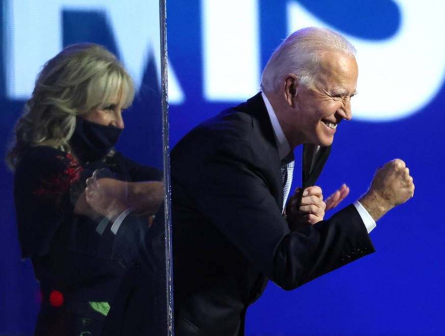 WILMINGTON, DELAWARE - NOVEMBER 07: President-elect Joe Biden greets crowd after his address to the nation from the Chase Center November 07, 2020 in Wilmington, Delaware. After four days of counting  ...