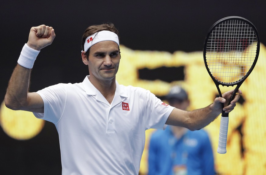 Switzerland&#039;s Roger Federer celebrates after defeating Britain&#039;s Daniel Evans in their second round match at the Australian Open tennis championships in Melbourne, Australia, Wednesday, Jan. ...