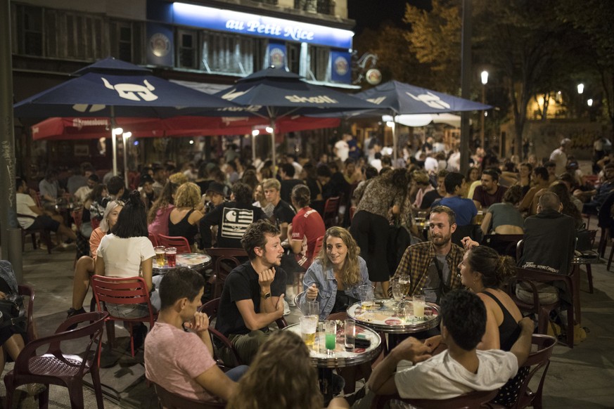 Friends have a drink together at a bar in Marseille, southern France, Saturday, Sept. 12, 2020. French Prime Minister Jean Castex warned that the virus situation is &quot;obviously worsening&quot; in  ...