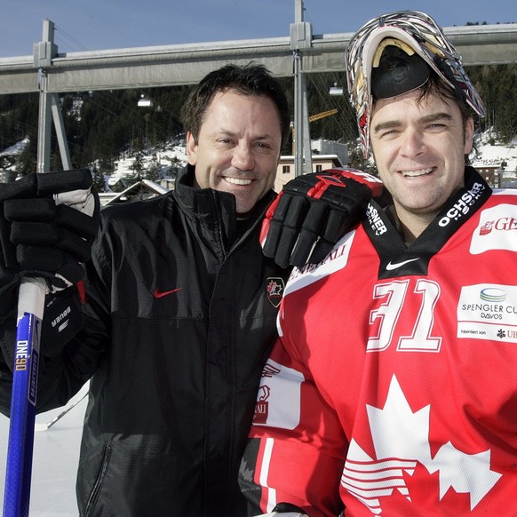 Team Canada&#039;s coach Doug Gilmour, left, and Team Canada&#039;s goalkeeper Joseph Curtis, right, pose prior a training session of Team Canada, during the 81th Spengler Cup ice hockey tournament, i ...