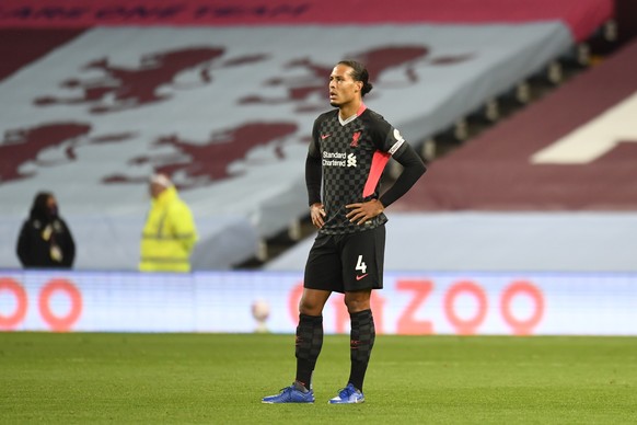 Liverpool&#039;s Virgil van Dijk gestures after Aston Villa&#039;s Ollie Watkins scores his side&#039;s second goal during the English Premier League soccer match between Aston Villa and Liverpool at  ...