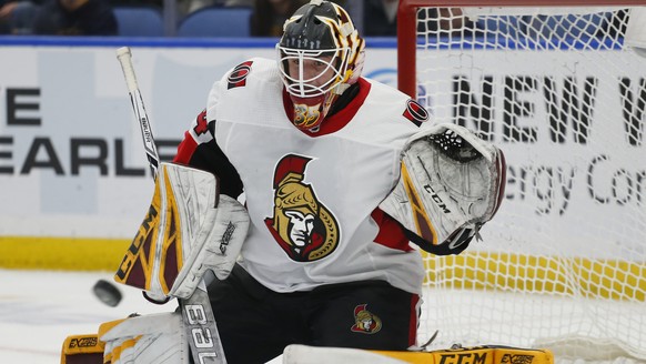 Ottawa Senators goalie Joey Daccord makes a save during the third period of the team&#039;s NHL hockey game against the Buffalo Sabres on Thursday, April 4, 2019, in Buffalo, N.Y. (AP Photo/Jeffrey T. ...