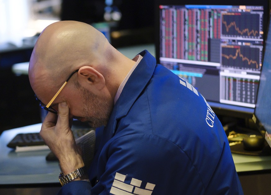 epa08273225 A specialist works on the floor of the New York Stock Exchange at the end of the day in New York, New York, USA, on 05 March 2020. The Dow Jones industrial average closed down nearly 1,000 ...