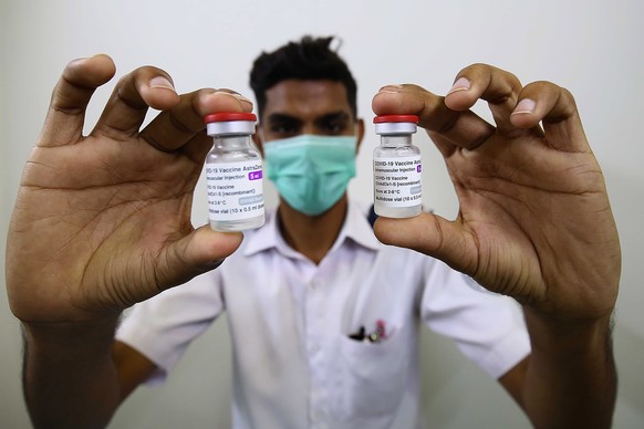 epa09193816 A health worker shows vials of the AstraZeneca&#039;s (AZD1222) vaccine against Covid-19, during the second phase of Pakistan&#039;s coronavirus vaccination drive in Karachi, Pakistan, 12  ...