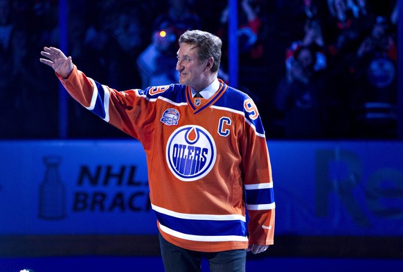 Former Edmonton Oilers player Wayne Gretzky waves to the crowd after the final NHL hockey game at Rexall Place, Wednesday, April 6, 2016, in Edmonton, Alberta. The Oilers defeated the Vancouver Canuck ...