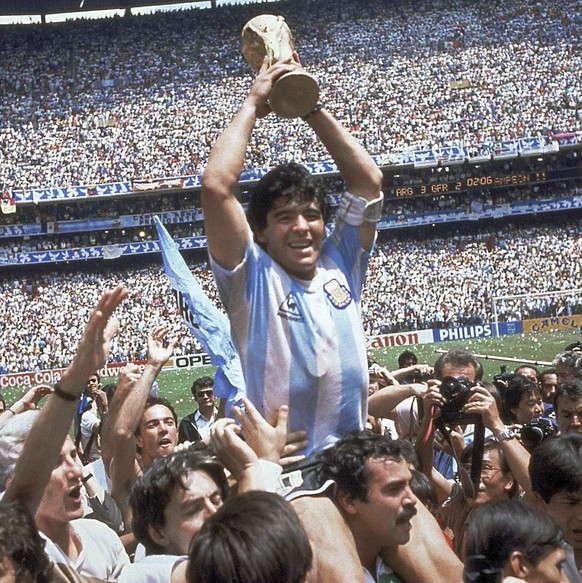 FILE - In this June 29, 1986 file photo, Diego Maradona holds up the trophy after Argentina defeated West Germany 3-2 during a World Cup soccer final match at Atzeca Stadium in Mexico City. The Argent ...