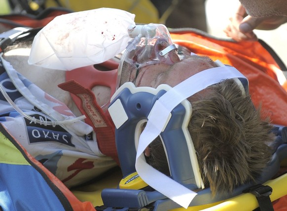 epa01801739 Saxo Bank rider Jens Voigt of Germany is attended to medics after a serious crash during the 16th stage of the Tour de France cycling race between Martigny in Switzerland and Bourg-Saint-M ...