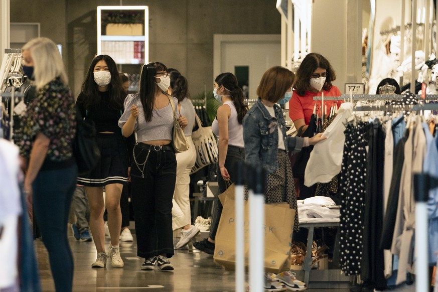 epa08564263 Shoppers in Oxford Street, Central London, Britain, 24 July 2020. Face coverings or masks have become mandatory for shoppers in England as well as members of the public using supermarkets, ...