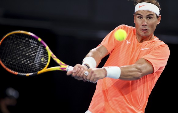 Spain&#039;s Rafael Nadal makes a backhand return to Austria&#039;s Dominic Thiem during an exhibition tennis event in Adelaide, Australia, Friday, Jan 29. 2021. (Kelly Barnes/AAP Image via AP)