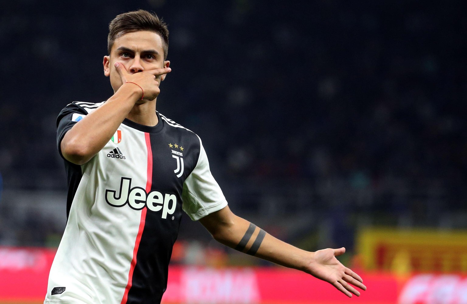 epa07902102 Juventus&#039; Paulo Dybala jubilates after scoring the 0-1 goal during the Italian serie A soccer match between FC Inter and Juventus FC at Giuseppe Meazza stadium in Milan, Italy, 6 Octo ...