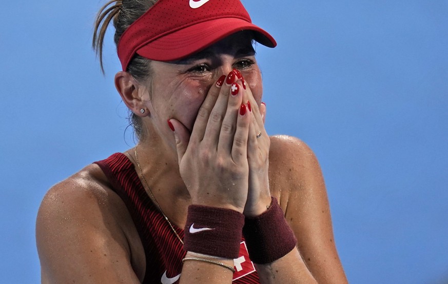 Belinda Bencic, of Switzerland, becomes emotional after defeating Elena Rybakina, of Kazakhstan, during the semifinals of the tennis competition at the 2020 Summer Olympics, Thursday, July 29, 2021, i ...
