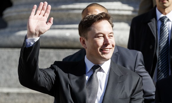 epa07485680 Tesla CEO Elon Musk (C) departs US Federal Court following a hearing in a lawsuit brought against him by the United States Security and Exchange Commission (SEC) in New York, New York, USA ...