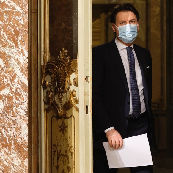 FILE-- Italian Premier Giuseppe Conte arrives for a press conference at Palazzo Chigi in Rome, Italy, Friday, Dec. 18, 2020. Conte intends to offer his resignation on Tuesday, Jan. 26, 2021, his offic ...