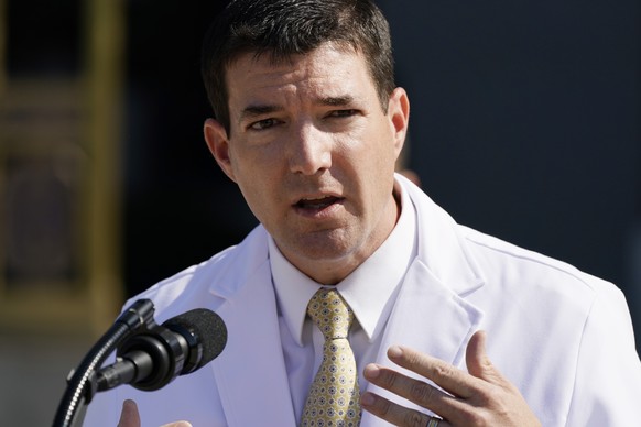 Dr. Sean Conley, physician to President Donald Trump, briefs reporters at Walter Reed National Military Medical Center in Bethesda, Md., Sunday, Oct. 4, 2020. Trump was admitted to the hospital after  ...