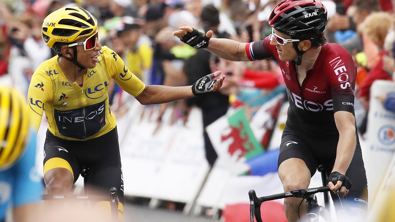 epa07744408 Colombia&#039;s Egan Bernal (L) of Team Ineos is congratulated by his British teammate Geraint Thomas (R) after retaining the overall leader&#039;s yellow jersey in the 20th stage of the 1 ...