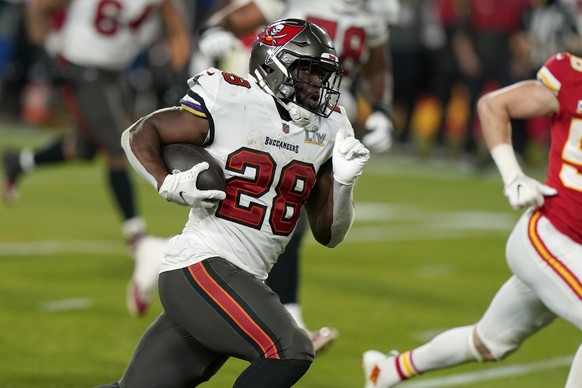 FILE - Tampa Bay Buccaneers running back Leonard Fournette sprints to the end zone to score on a 27-yard touchdown run during the second half of the NFL Super Bowl 55 football game against the Kansas  ...