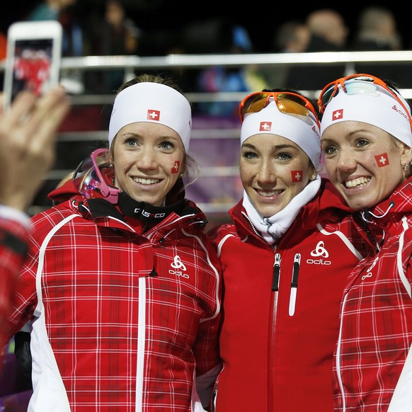 From left: The sisters Elisa Gasparin, Aita Gasparin and Selina Gasparin of Switzerland pose after the women&#039;s 4x6km biathlon relay at the XXII Winter Olympics 2014 Sochi in Krasnaya Polyana, Rus ...