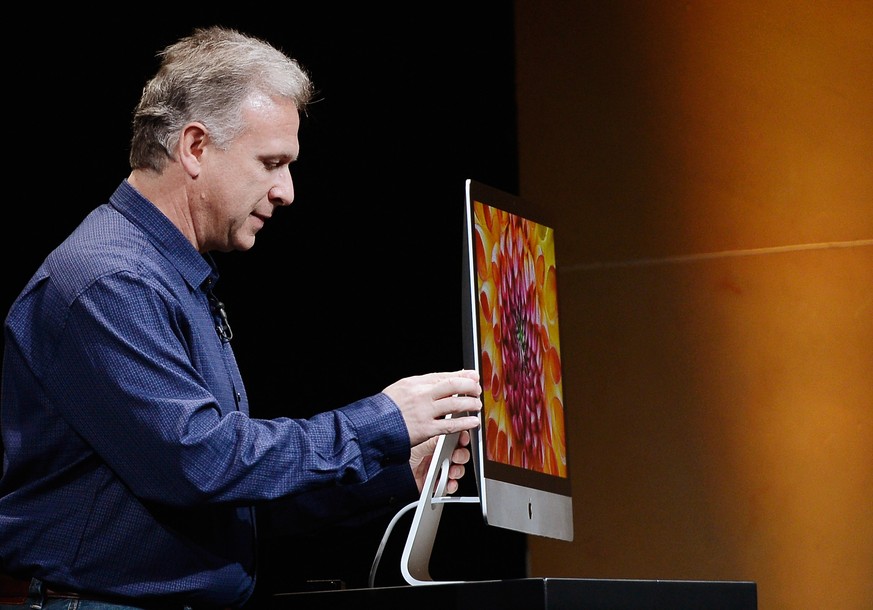 SAN JOSE, CA - OCTOBER 23: Apple Senior Vice President of Worldwide product marketing Phil Schiller announces the new iMac during an Apple special event at the historic California Theater on October 2 ...