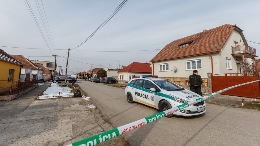 epa06566816 A police officer secure the crime site where Slovak journalist Jan Kuciak was found shot dead together with his girlfriend Martina in Velka Maca near Bratislava, Slovakia, 26 February 2018 ...