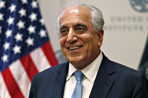 FILE - In this Feb. 8, 2019 file photo, Special Representative for Afghanistan Reconciliation Zalmay Khalilzad smiles at the U.S. Institute of Peace, in Washington. Khalilzad and the Taliban have resu ...