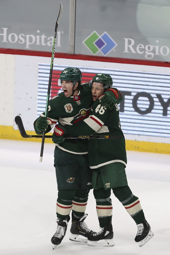 Minnesota Wild&#039;s Kevin Fiala (22) hugs teammate Jared Spurgeon (46) after scoring a goal during the third period of an NHL hockey game against the Colorado Avalanche, Monday, April 5, 2021, in St ...