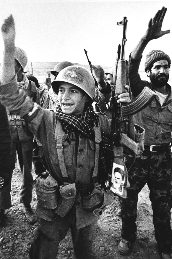 This young Iranian soldier shouts &quot;Allahu Akhbar,&quot; God is Great, the battle cry from the trenches during the Iran-Iraq War, in Ein Khosh, Iran, Nov. 1982. Tens of thousands of teenage Irania ...