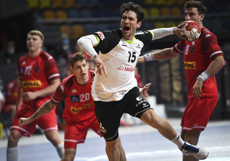 epa08937737 Switzerland&#039;s Nicolas Raemy in action during the match between Austria and Switzerland at the 27th Men&#039;s Handball World Championship in Cairo, Egypt, 14 January 2021. EPA/Anne-Ch ...