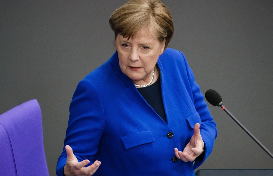 epa08419393 German Chancellor Angela Merkel gestures during a question and answer session of the German parliament &#039;Bundestag&#039; in Berlin, Germany, 13 May 2020. Members of the German Bundesta ...