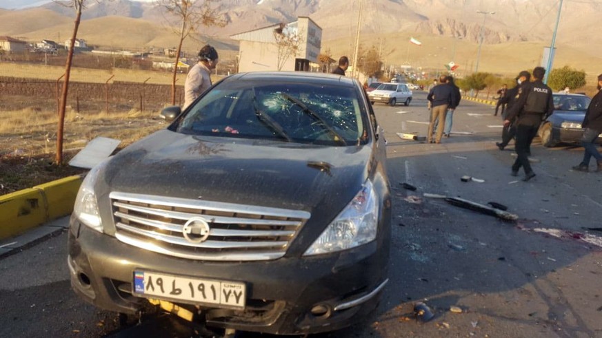 epa08846408 A handout photo made available by Iranian state TV (IRIB) official website shows the scene of terror attack on top Iranian nuclear scientist Mohsen Fakhrizadeh, in the city of Damavand, no ...